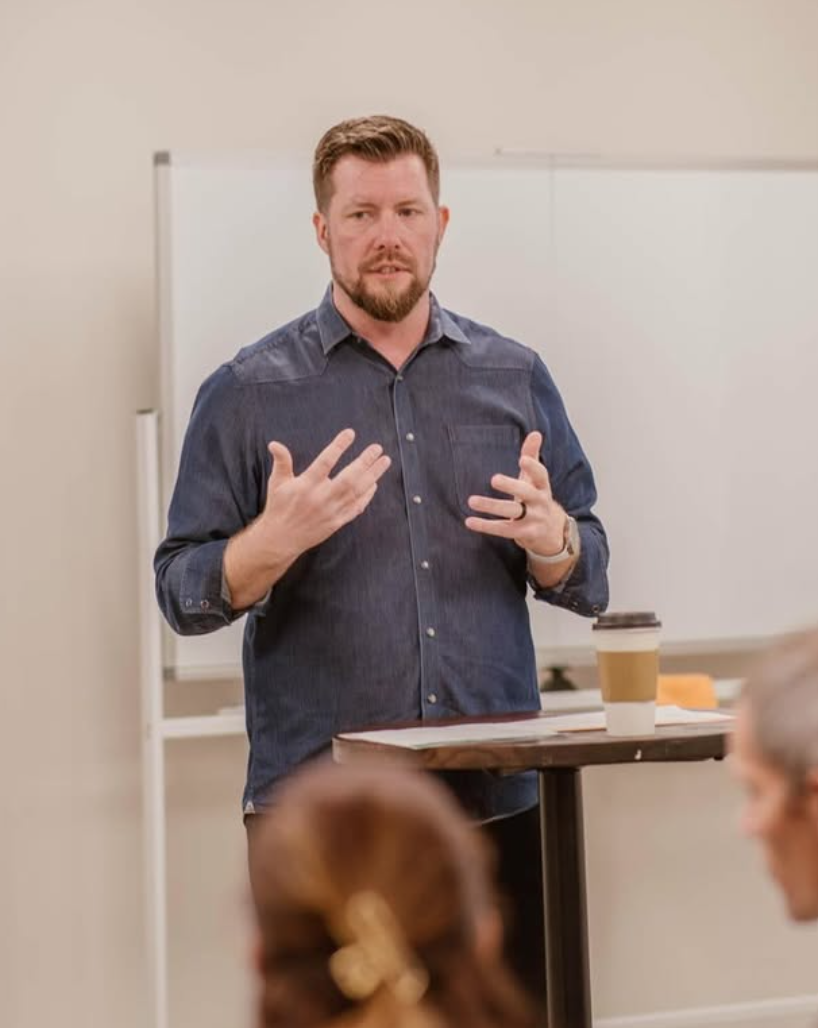 A pastor teaching the Next Steps Class to a room of guests