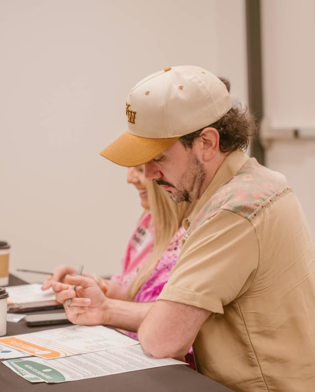 Guests filling out their Next Steps materials during class